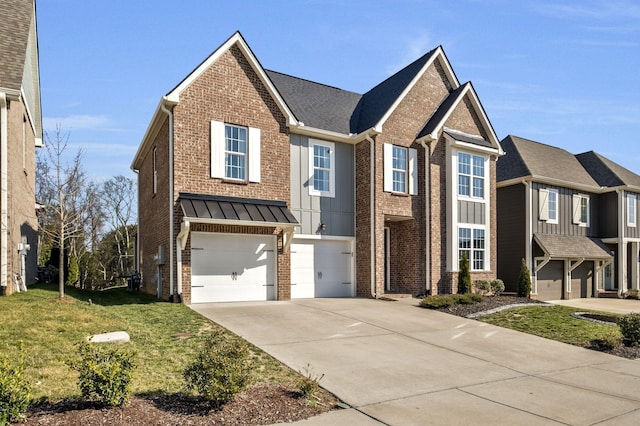 view of front of house featuring a garage, a front lawn, brick siding, and driveway