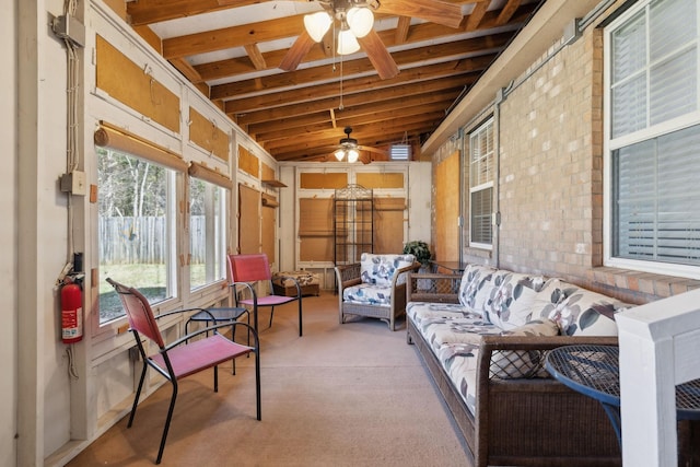 sunroom / solarium with a ceiling fan