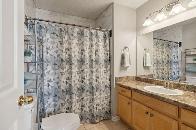 bathroom featuring tile patterned floors, a shower with curtain, toilet, a textured ceiling, and vanity