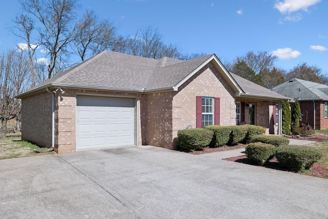 view of home's exterior with brick siding, roof with shingles, concrete driveway, and an attached garage