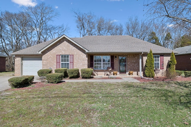 ranch-style home featuring brick siding, a front lawn, roof with shingles, driveway, and an attached garage