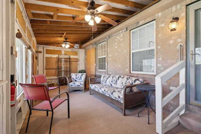 sunroom with vaulted ceiling and ceiling fan