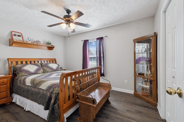 bedroom with baseboards, a textured ceiling, ceiling fan, and dark wood-style flooring