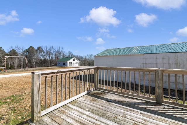 wooden terrace featuring an outdoor structure