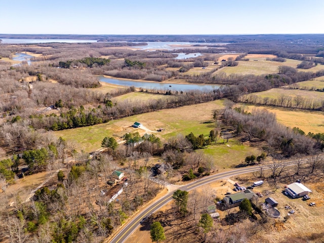 drone / aerial view featuring a water view and a rural view