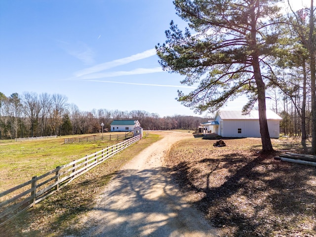 view of road featuring a rural view and driveway