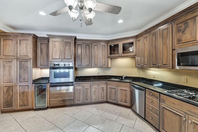 kitchen with wine cooler, light tile patterned floors, stainless steel appliances, and a sink