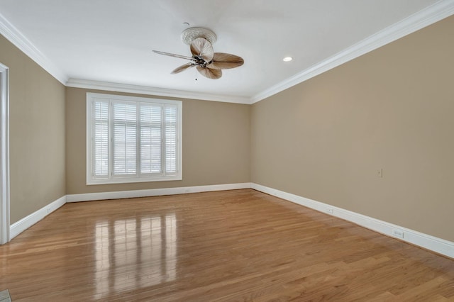 unfurnished room with ornamental molding, a ceiling fan, wood finished floors, recessed lighting, and baseboards