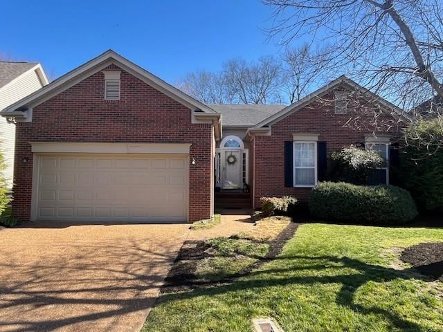 ranch-style home with concrete driveway, an attached garage, brick siding, and a front lawn