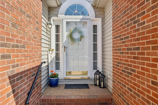 entrance to property with brick siding