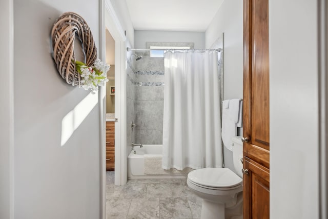 bathroom featuring toilet and shower / bath combo