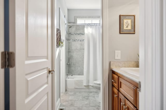 full bathroom with shower / tub combo with curtain, marble finish floor, toilet, and vanity