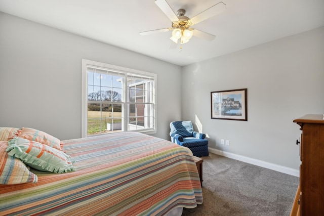 carpeted bedroom with baseboards and ceiling fan