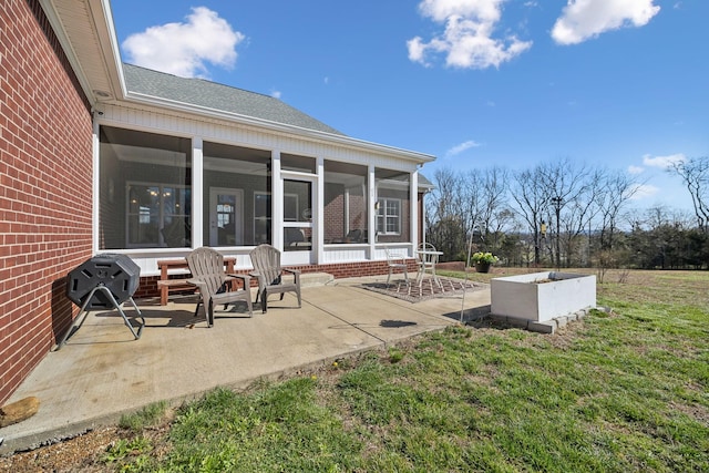 view of patio / terrace featuring a sunroom