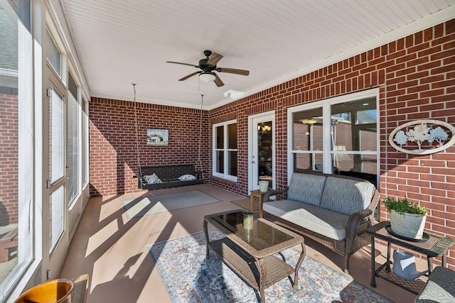 sunroom with a ceiling fan