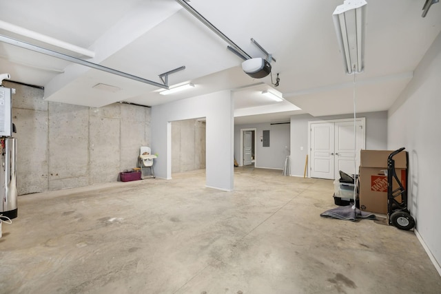 garage featuring electric panel and a garage door opener