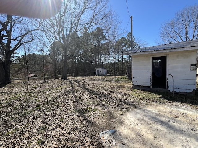 view of yard with a shed and an outdoor structure