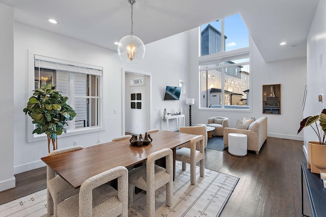 dining area featuring recessed lighting, baseboards, and wood-type flooring