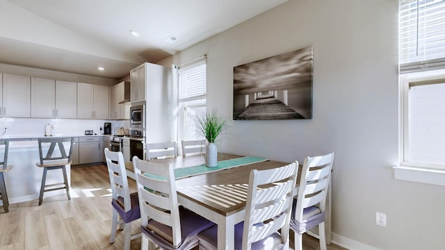 dining area featuring recessed lighting and light wood finished floors