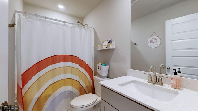 bathroom with vanity, curtained shower, toilet, and recessed lighting