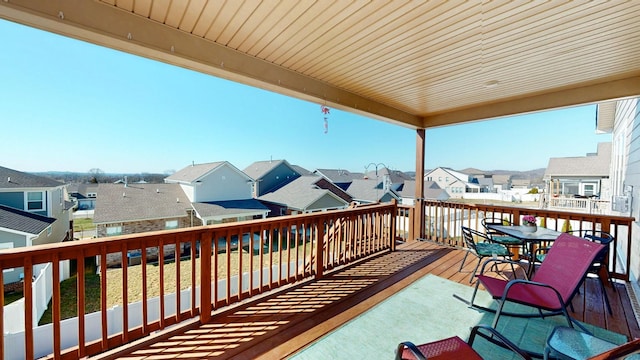 wooden terrace with a residential view