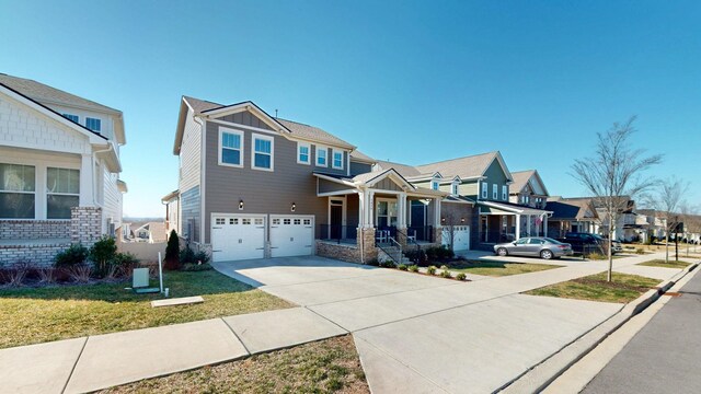 craftsman-style home featuring a residential view, an attached garage, board and batten siding, and driveway