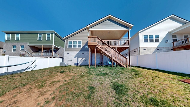 back of property featuring stairs, a yard, a fenced backyard, and central AC