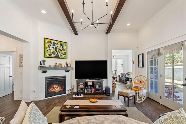 living area featuring beamed ceiling, recessed lighting, a fireplace, and wood finished floors