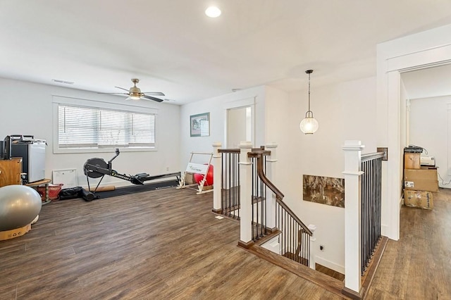 workout area featuring wood finished floors, baseboards, visible vents, recessed lighting, and ceiling fan