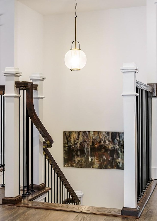 stairway with wood finished floors