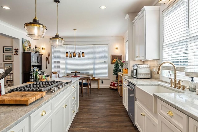 kitchen with a sink, dark wood finished floors, white cabinetry, recessed lighting, and stainless steel appliances