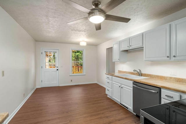 kitchen featuring dark wood-style floors, baseboards, a sink, a textured ceiling, and stainless steel dishwasher