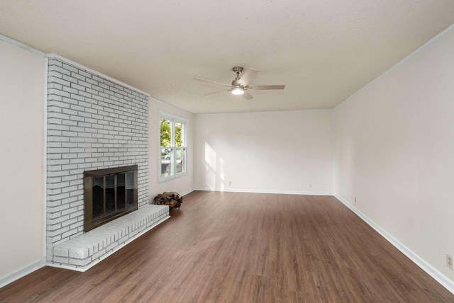 unfurnished living room featuring ceiling fan, baseboards, wood finished floors, and a fireplace