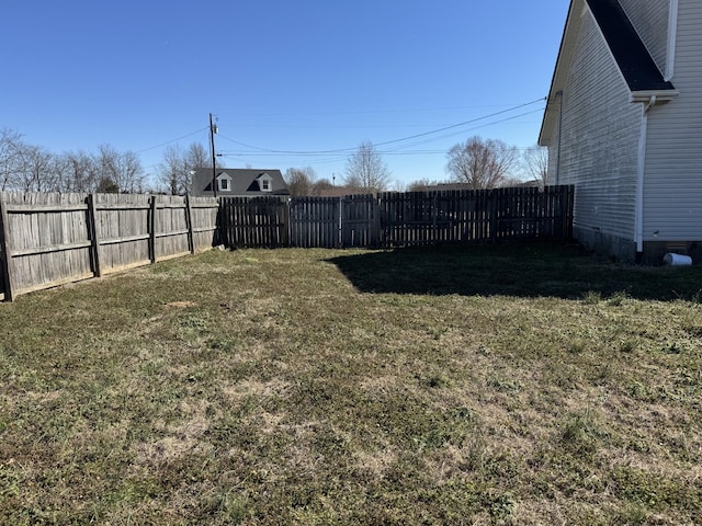 view of yard with a fenced backyard