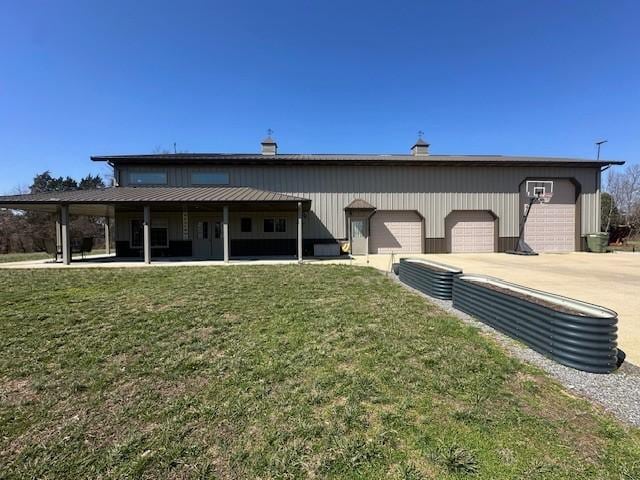 view of front of home with a garage and a front lawn