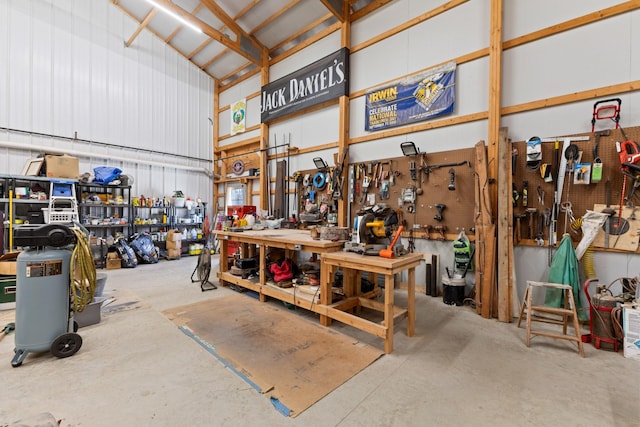 garage featuring a workshop area and metal wall