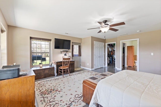 bedroom featuring visible vents, ceiling fan, baseboards, and wood finished floors