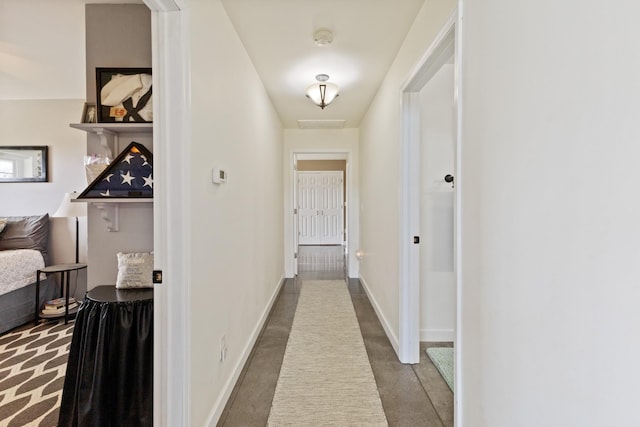 hallway featuring baseboards