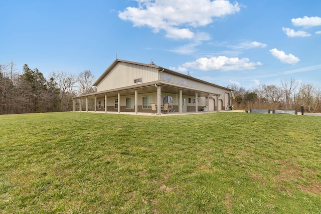 rear view of property with a yard