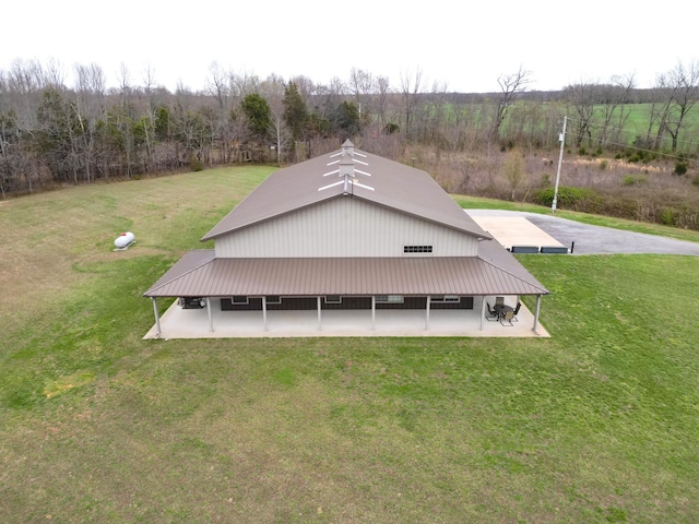 back of property with a lawn