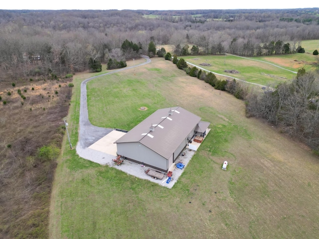 bird's eye view with a rural view and a wooded view