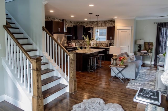 stairs featuring crown molding, recessed lighting, wood finished floors, and baseboards