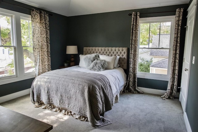 bedroom featuring carpet flooring and baseboards