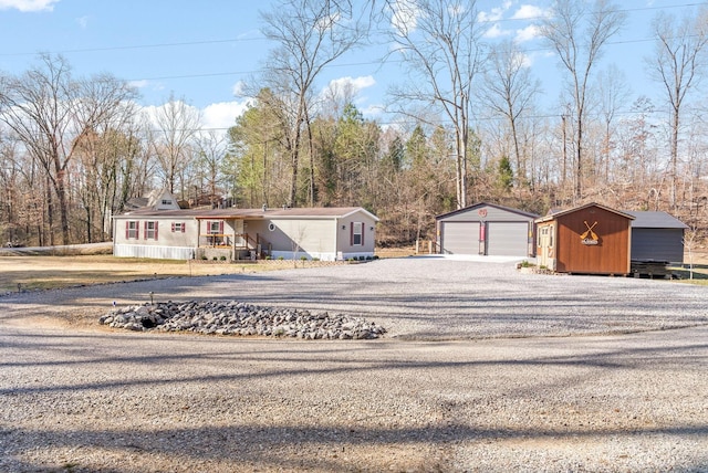 view of front of home with an outbuilding and a detached garage