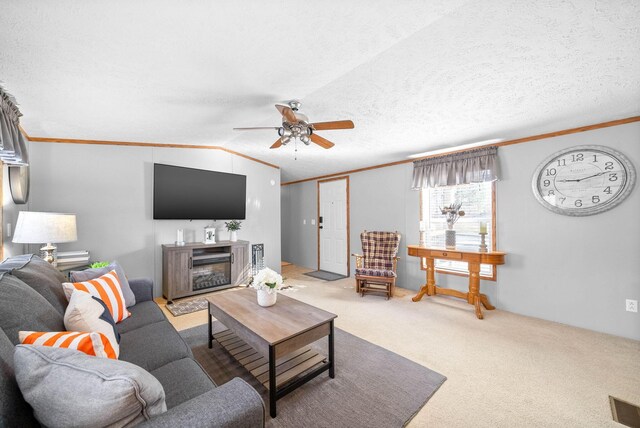 carpeted living room featuring crown molding, a ceiling fan, lofted ceiling, and a textured ceiling