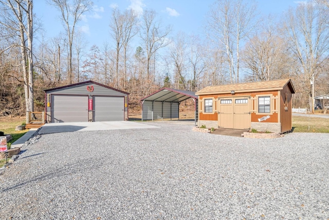 view of front facade with a detached garage and an outdoor structure