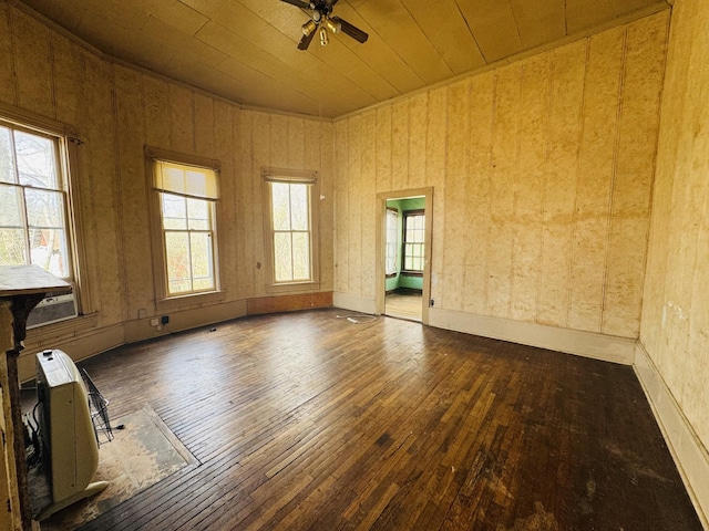 spare room featuring wooden ceiling, ceiling fan, and wood-type flooring