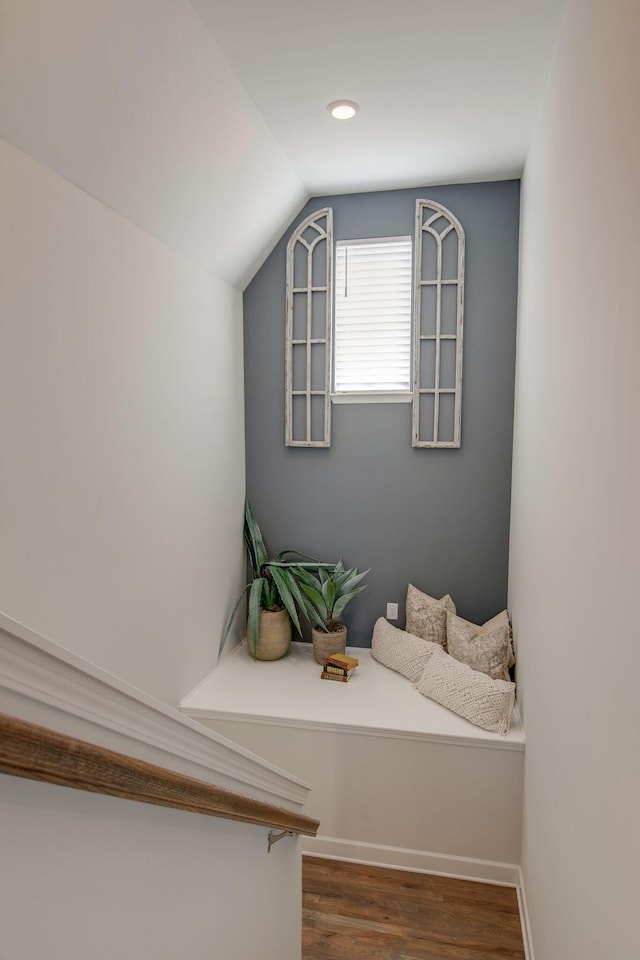 interior space with baseboards and wood finished floors