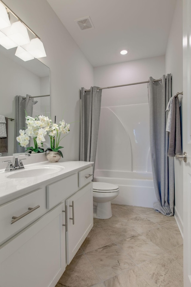 bathroom with visible vents, toilet, vanity, and shower / bath combination with curtain