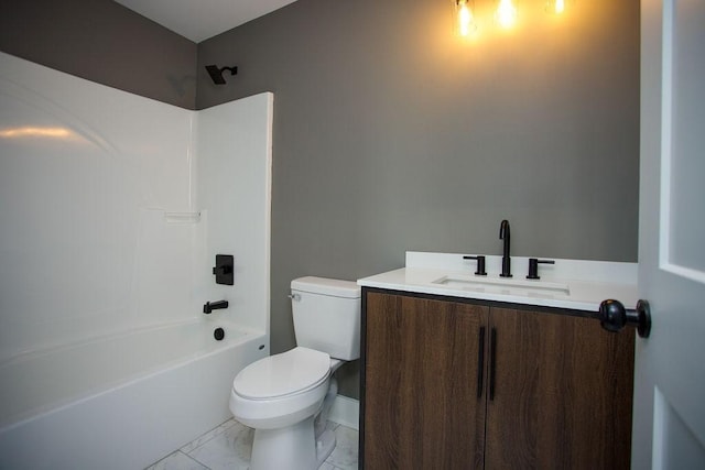 bathroom with toilet, marble finish floor, shower / washtub combination, and vanity